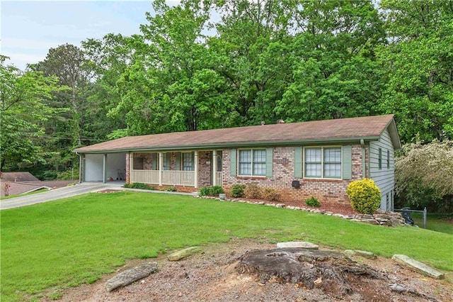 ranch-style house with a front lawn, covered porch, brick siding, driveway, and a carport