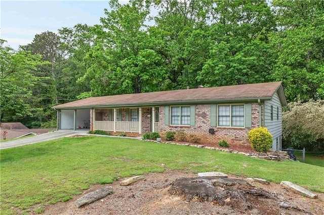 ranch-style house with brick siding, driveway, a front yard, and a carport