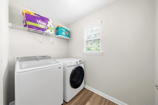 5155 Scenic View Rd, Flowery Branch, GA 30542 - laundry area featuring washing machine and clothes dryer, wood finished floors, and baseboards