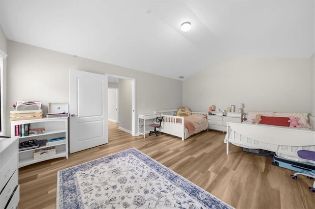 5155 Scenic View Rd, Flowery Branch, GA 30542 - bedroom featuring wood finished floors and vaulted ceiling