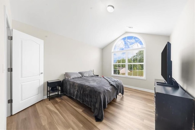 5155 Scenic View Rd, Flowery Branch, GA 30542 - bedroom featuring vaulted ceiling, light wood-style flooring, and baseboards