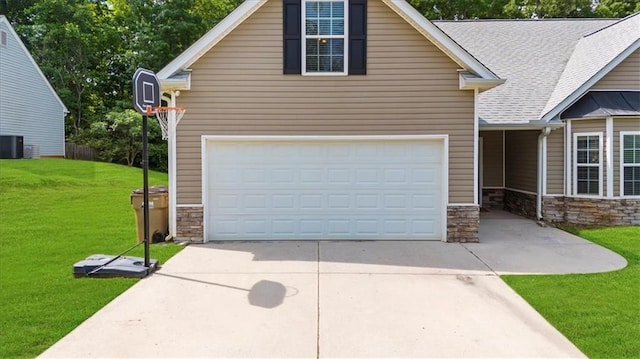 5155 Scenic View Rd, Flowery Branch, GA 30542 - view of front of home featuring stone siding, a garage, a front yard, driveway, and cooling unit