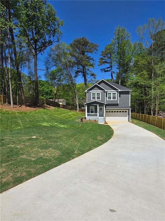 113 Miller Rd, Stockbridge, GA 30281 - craftsman house with driveway, fence, a front yard, and a garage
