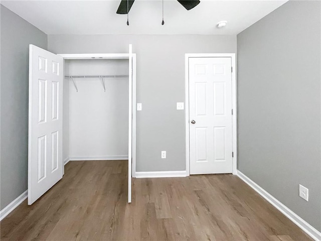 113 Miller Rd, Stockbridge, GA 30281 - unfurnished bedroom with baseboards, wood finished floors, and a closet