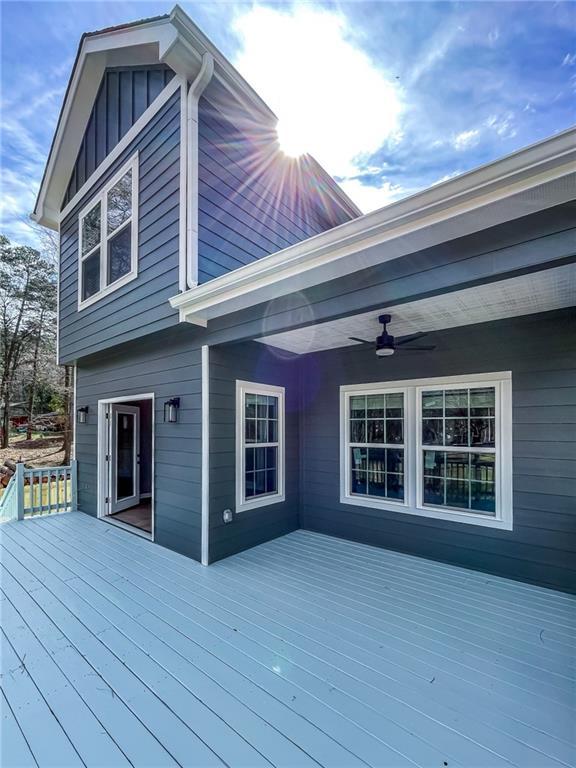 wooden deck with a ceiling fan