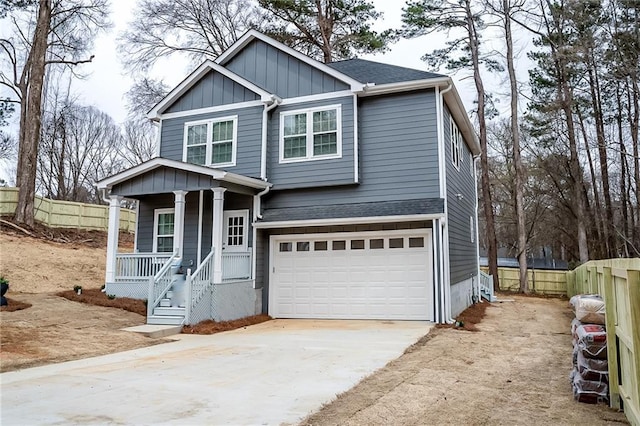 view of front of house featuring board and batten siding, fence, concrete driveway, and roof with shingles