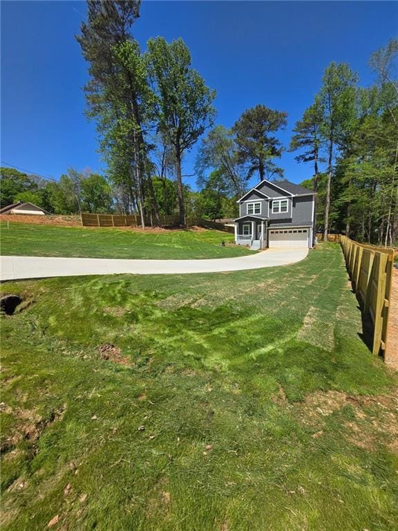 113 Miller Rd, Stockbridge, GA 30281 - view of yard featuring an attached garage and fence