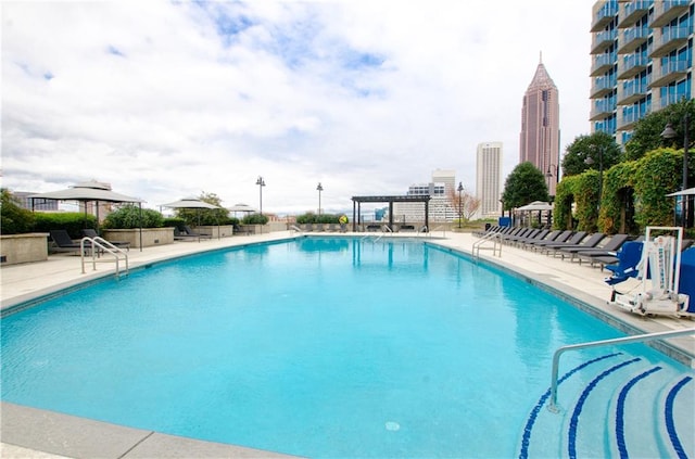 view of swimming pool with a patio area