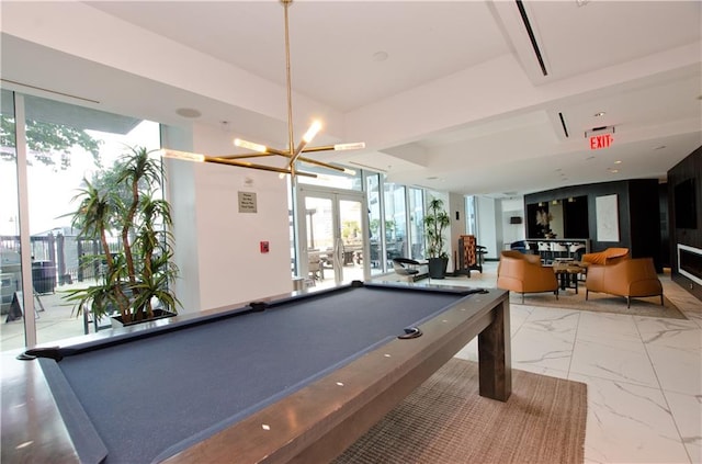 rec room featuring french doors, pool table, and an inviting chandelier