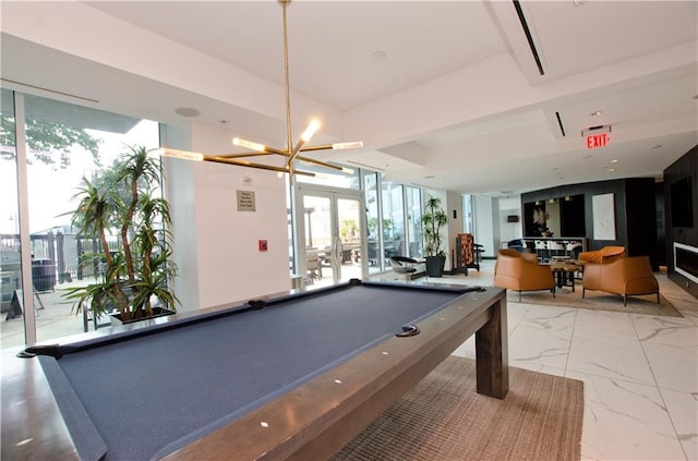playroom with billiards, marble look tiles, french doors, and a chandelier