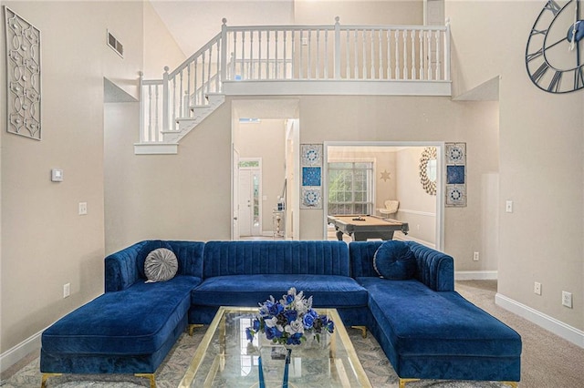 living room with visible vents, billiards, baseboards, and a high ceiling