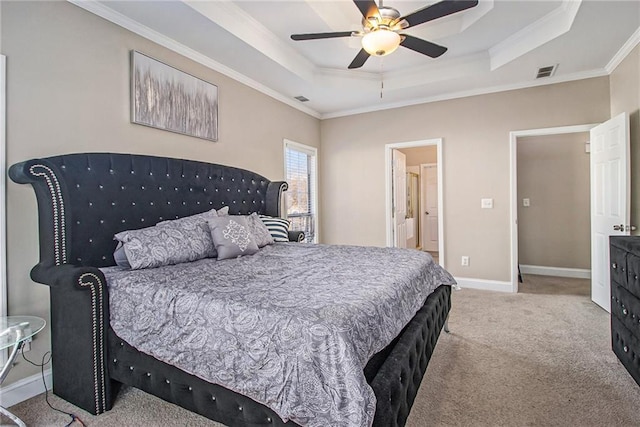 bedroom with carpet flooring, a tray ceiling, crown molding, visible vents, and baseboards