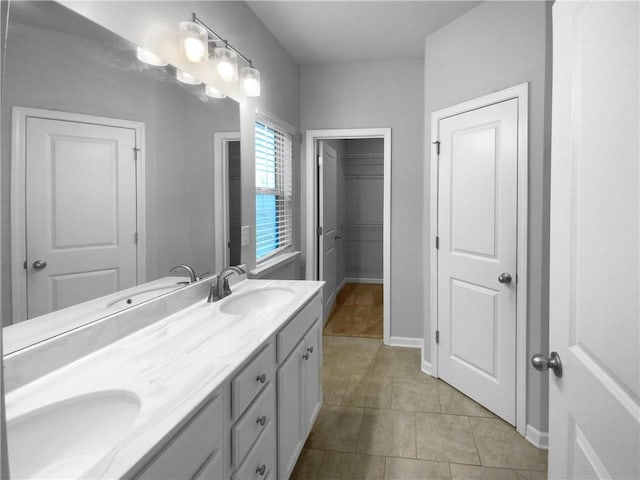 bathroom featuring tile patterned flooring and vanity