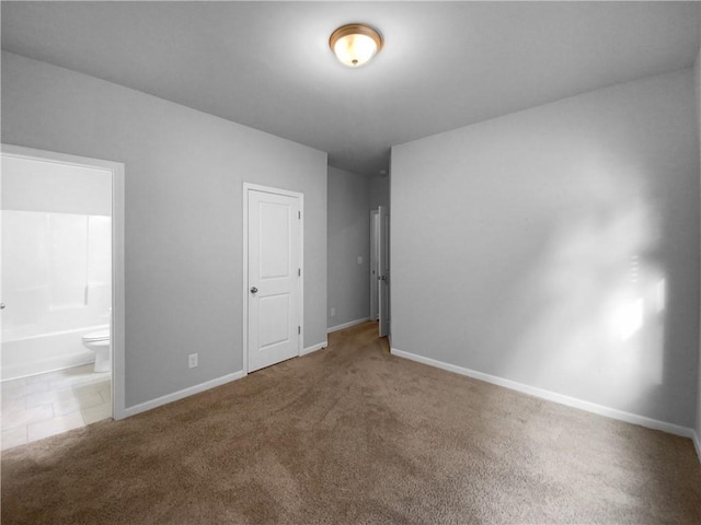 unfurnished room featuring carpet flooring