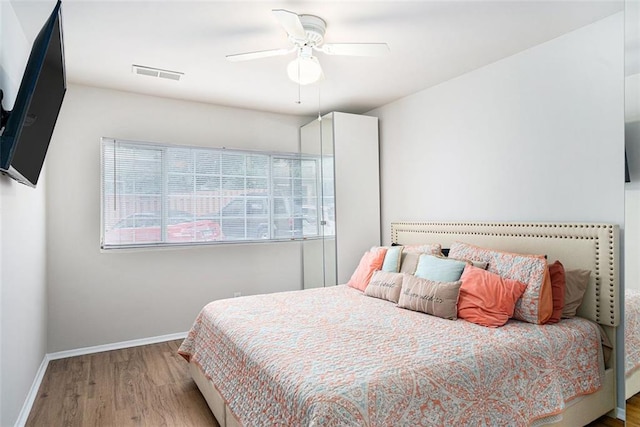 1705 Monroe Dr NE Unit E3, Atlanta, GA 30324 - bedroom featuring wood finished floors and a ceiling fan