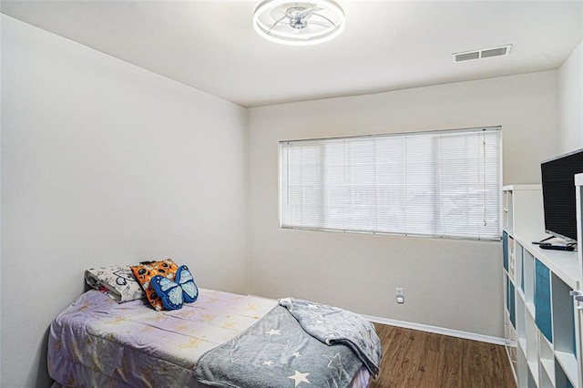 1705 Monroe Dr NE Unit E3, Atlanta, GA 30324 - bedroom featuring wood finished floors and multiple windows
