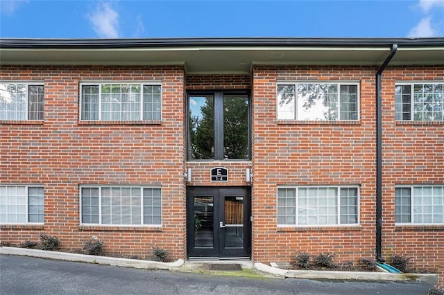 1705 Monroe Dr NE Unit E3, Atlanta, GA 30324 - entrance to property featuring french doors and brick siding