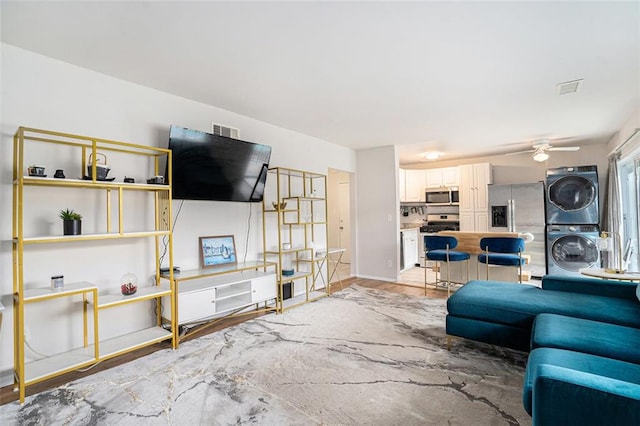 1705 Monroe Dr NE Unit E3, Atlanta, GA 30324 - living area with stacked washer / drying machine and ceiling fan