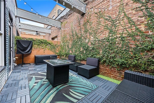 view of patio featuring a jacuzzi