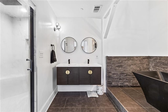 bathroom with vanity, tile patterned floors, and shower with separate bathtub