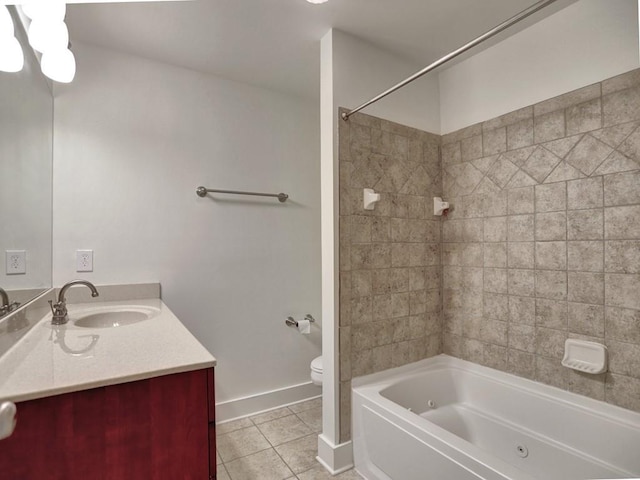 full bathroom with tile patterned flooring, vanity, toilet, and tiled shower / bath