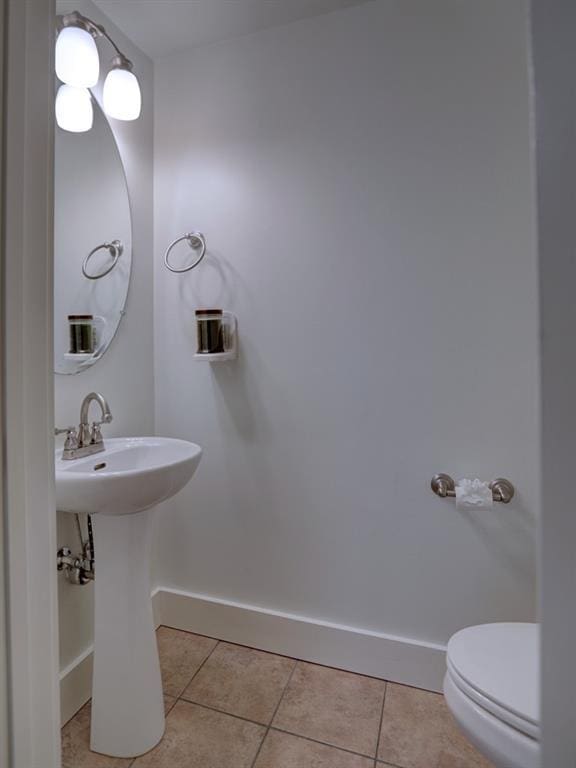 bathroom featuring tile patterned floors and toilet