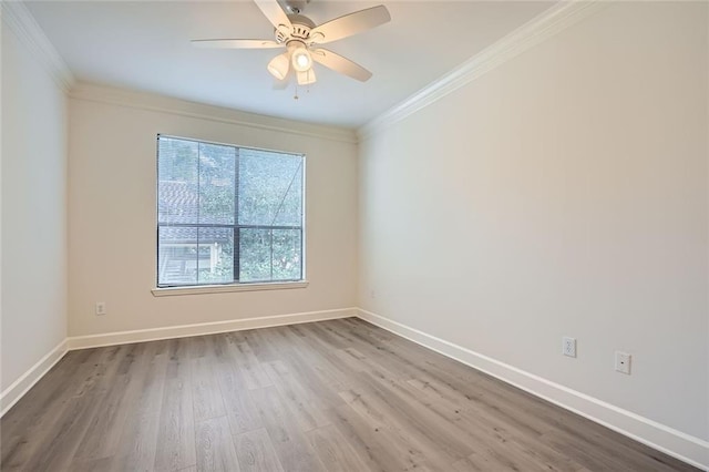 unfurnished room featuring crown molding, ceiling fan, and wood-type flooring