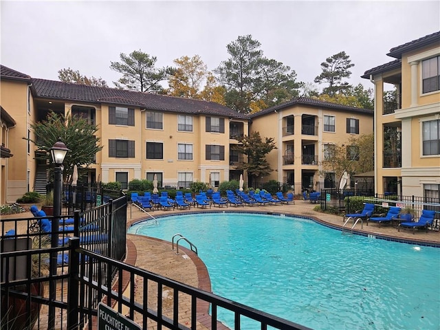 view of swimming pool featuring a patio area