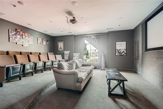 cinema room with crown molding, carpet, and a textured ceiling