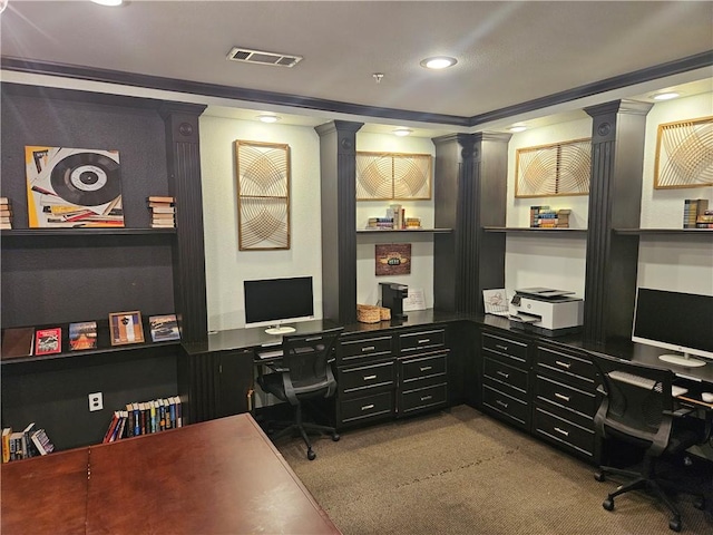 home office with decorative columns, light carpet, and built in desk