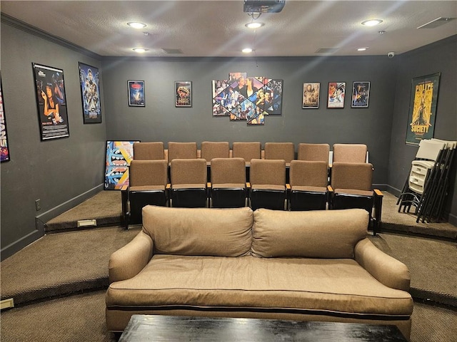 carpeted home theater featuring ornamental molding and a textured ceiling