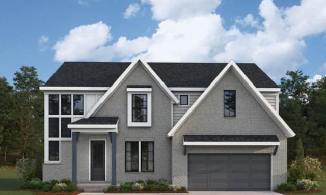 view of front of property with brick siding, an attached garage, and driveway