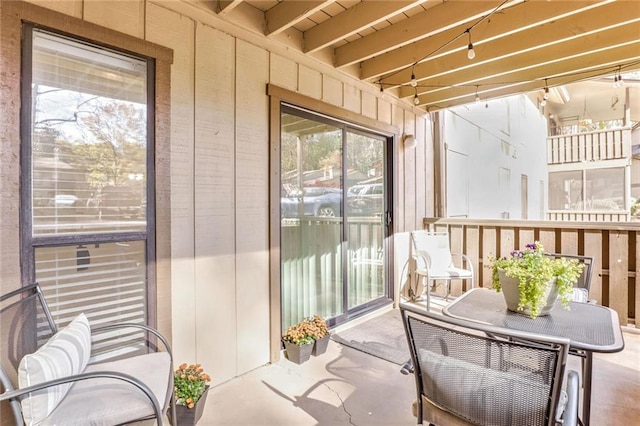 sunroom / solarium with beamed ceiling