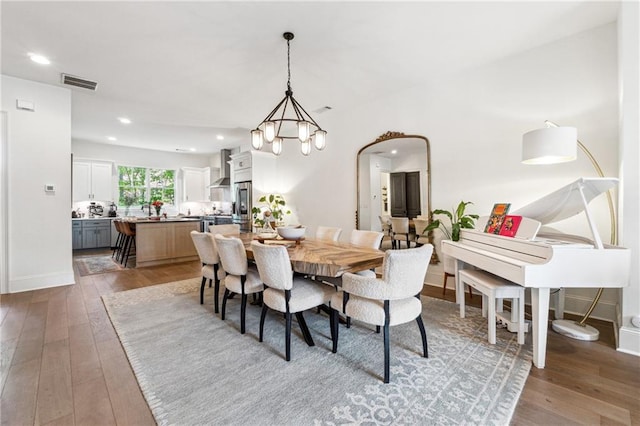 3667 Peachtree Rd NE Unit 6, Atlanta, GA 30319 - dining room featuring light wood-style floors, a chandelier, recessed lighting, and baseboards