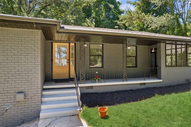 doorway to property featuring a porch