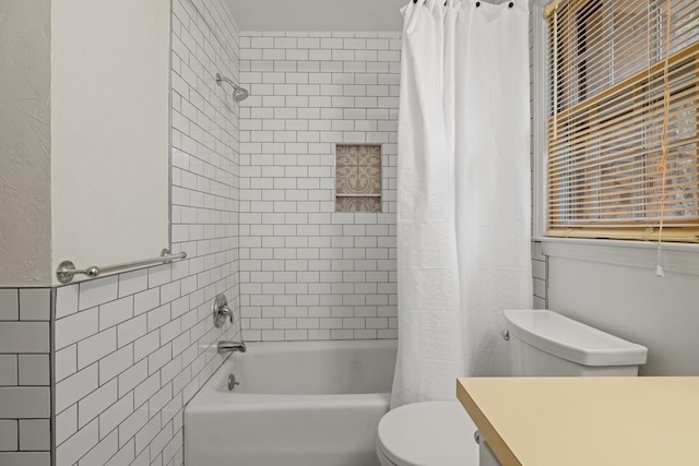 full bathroom featuring vanity, toilet, tile walls, and shower / bath combo