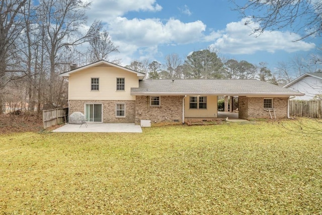 rear view of property with a patio area and a lawn