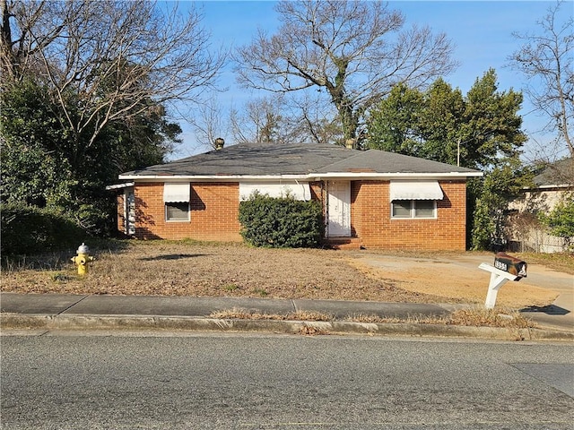 view of front of home featuring brick siding