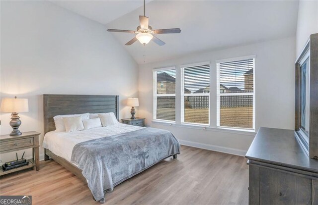 1023 Boulder Dr, Gray, GA 31032 - bedroom featuring baseboards, light wood finished floors, a ceiling fan, and vaulted ceiling