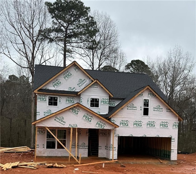1023 Boulder Dr, Gray, GA 31032 - view of front of house featuring covered porch, roof with shingles, and an attached garage