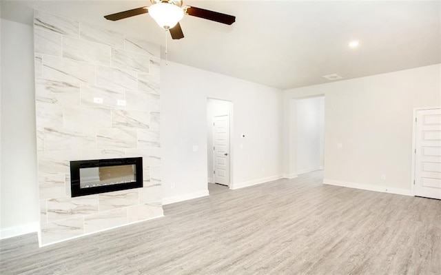 1023 Boulder Dr, Gray, GA 31032 - unfurnished living room featuring baseboards, a high end fireplace, ceiling fan, and wood finished floors