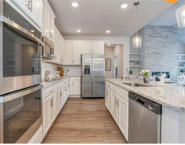 1023 Boulder Dr, Gray, GA 31032 - kitchen with a sink, white cabinetry, and appliances with stainless steel finishes