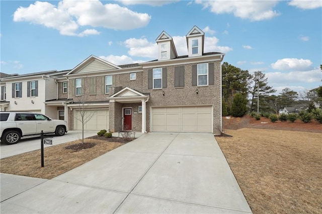 townhome / multi-family property featuring a garage