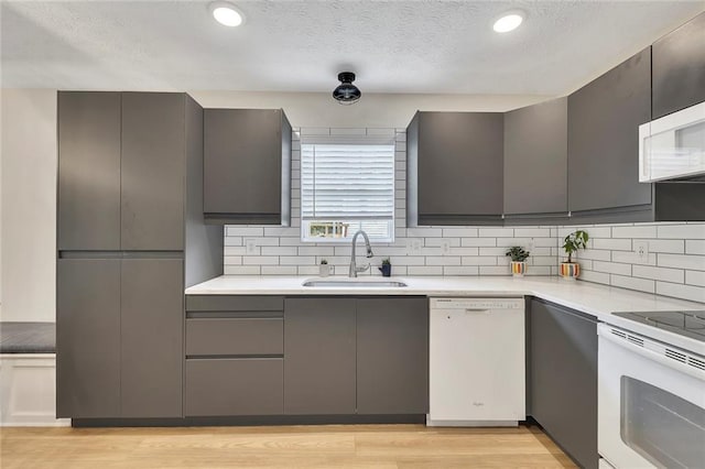 15 Echota Rd NE, Cartersville, GA 30121 - kitchen with white appliances, gray cabinetry, backsplash, light countertops, and a textured ceiling