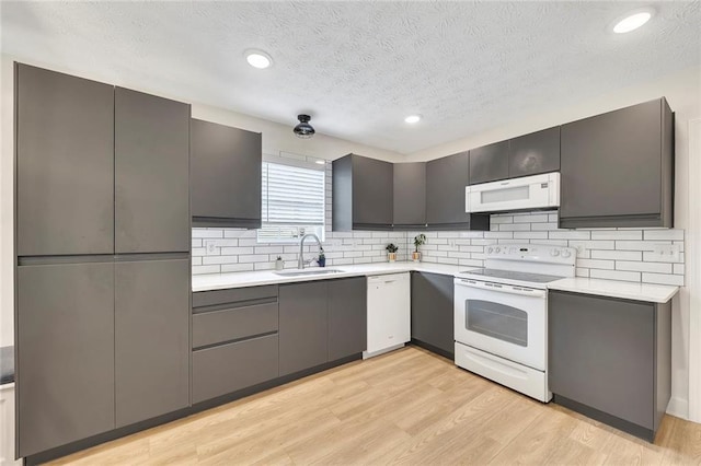 15 Echota Rd NE, Cartersville, GA 30121 - kitchen featuring white appliances, light countertops, backsplash, a textured ceiling, and light wood-type flooring