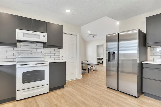 15 Echota Rd NE, Cartersville, GA 30121 - kitchen featuring white appliances, light countertops, tasteful backsplash, light wood finished floors, and a textured ceiling