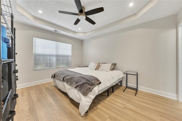 15 Echota Rd NE, Cartersville, GA 30121 - bedroom featuring a tray ceiling, light wood-type flooring, recessed lighting, and ceiling fan