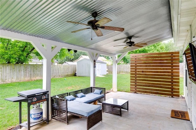 15 Echota Rd NE, Cartersville, GA 30121 - fenced backyard with a storage unit, a patio area, ceiling fan, and an outdoor hangout area