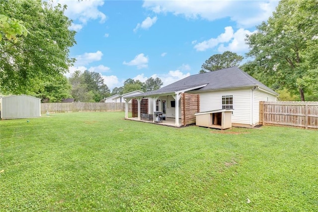 15 Echota Rd NE, Cartersville, GA 30121 - rear view of house featuring a storage unit, a fenced backyard, and a patio