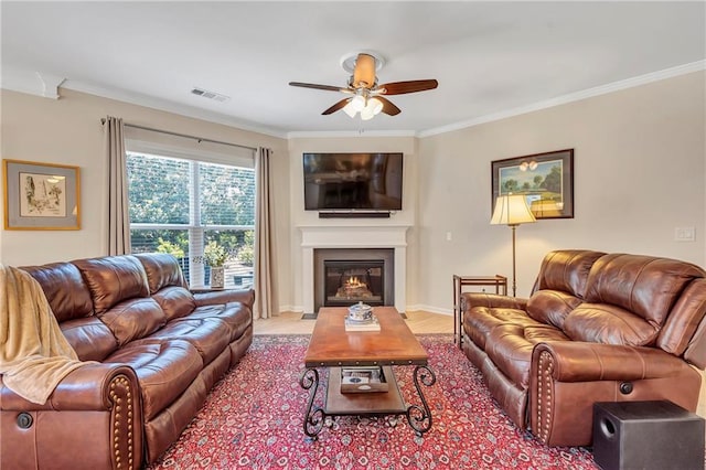 2920 Farmstead Way, Suwanee, GA 30024 - living area with a ceiling fan, crown molding, a glass covered fireplace, and wood finished floors
